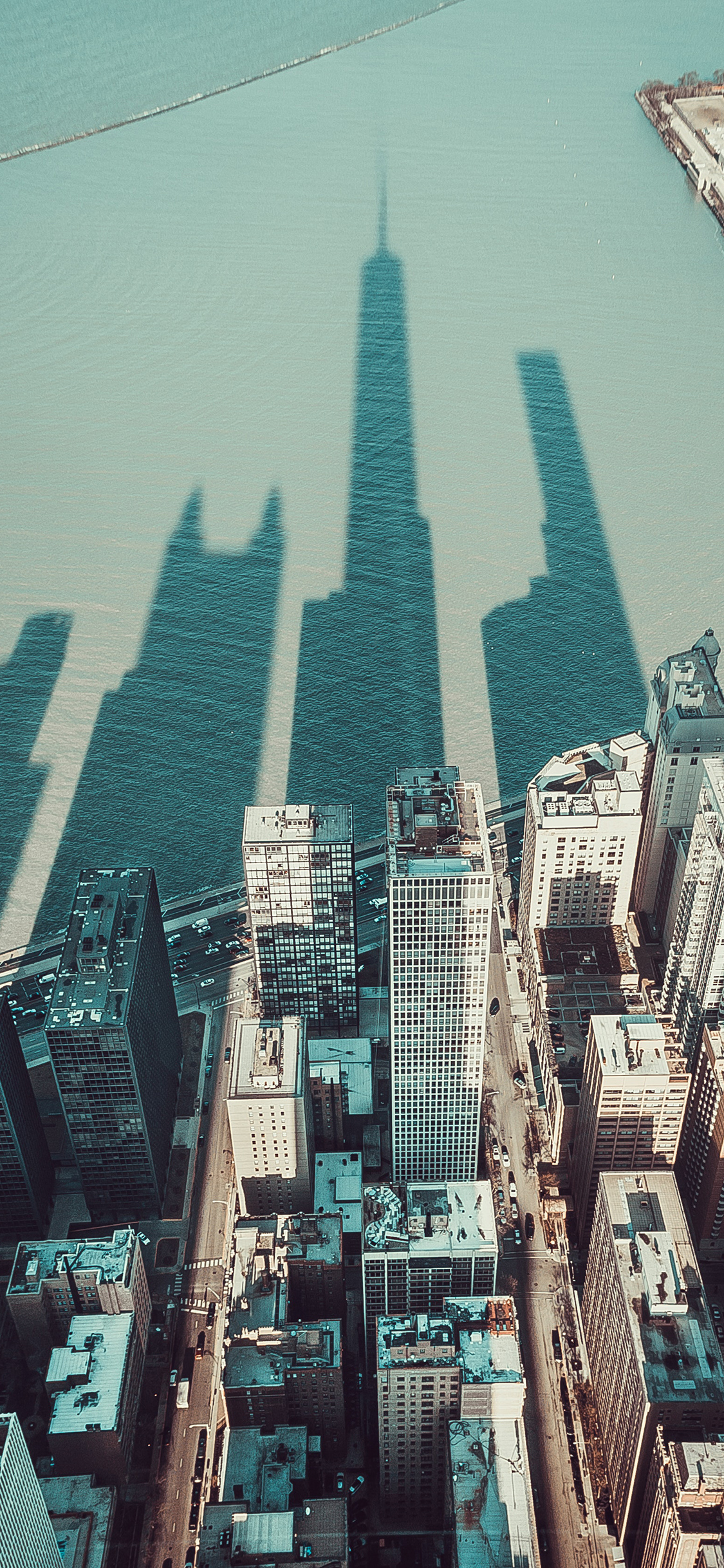 [2436×1125]城市 建筑 楼房 影子 苹果手机壁纸图片