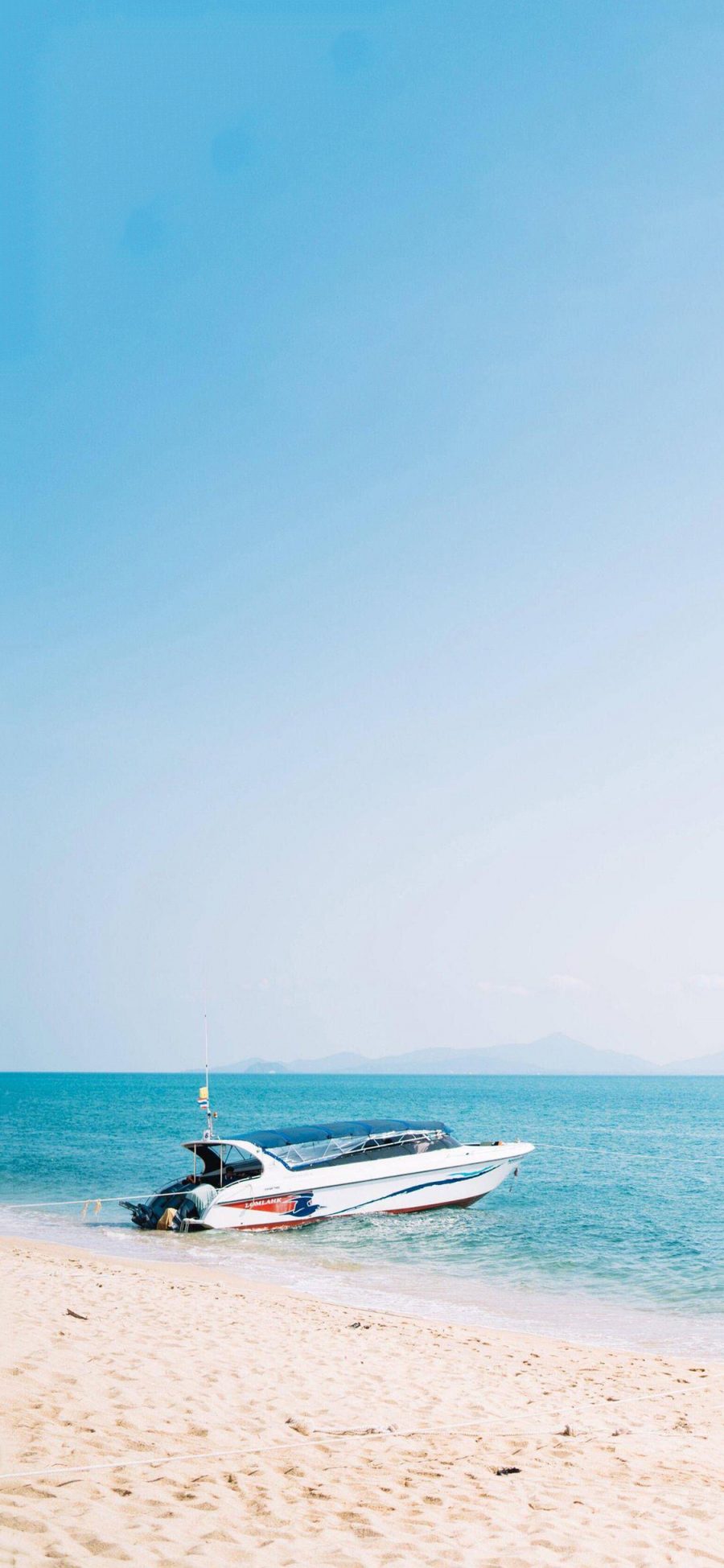 [2436×1125]快艇 船 海边 沙滩 蓝色 苹果手机壁纸图片
