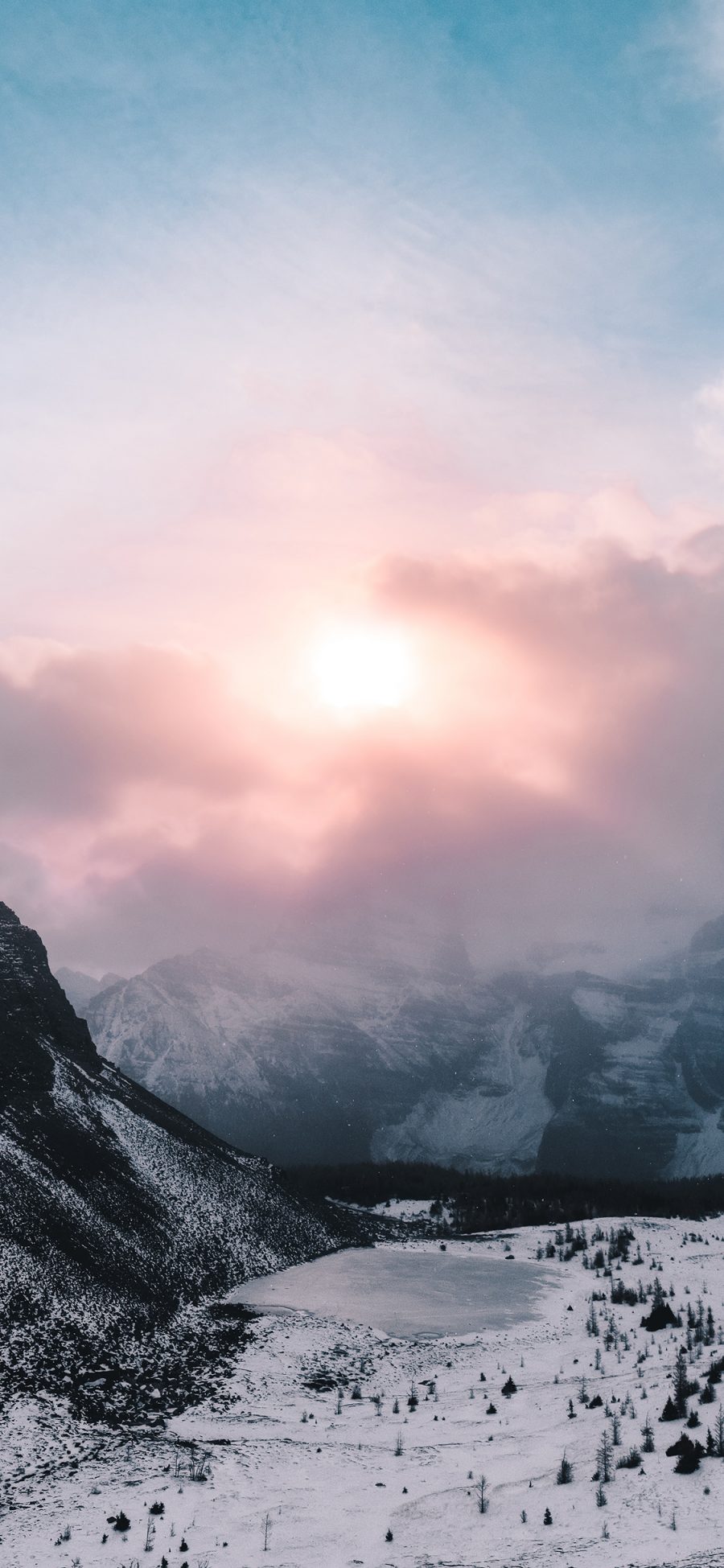 [2436×1125]景色 阳光 云雾 雪季 山脚 苹果手机壁纸图片