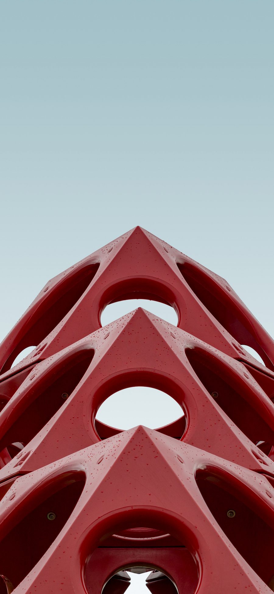 [2436×1125]红色建筑和 三角 镂空 圆形 苹果手机壁纸图片